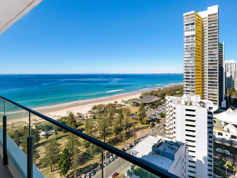 Spacious living area at ULTIQA Points North with ocean views from the balcony.