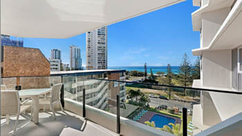 Private balcony with outdoor dining and ocean views at ULTIQA Beach Haven on Broadbeach.