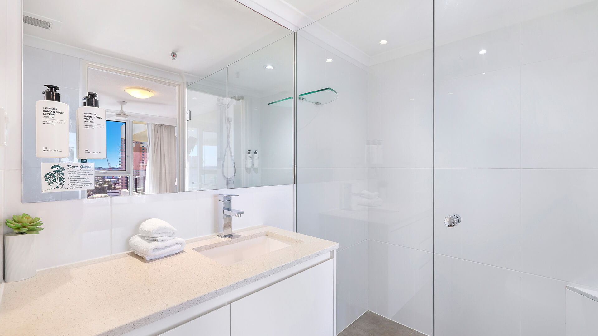 Contemporary bathroom with walk-in shower at ULTIQA Beach Haven on Broadbeach, Surfers Paradise apartment.