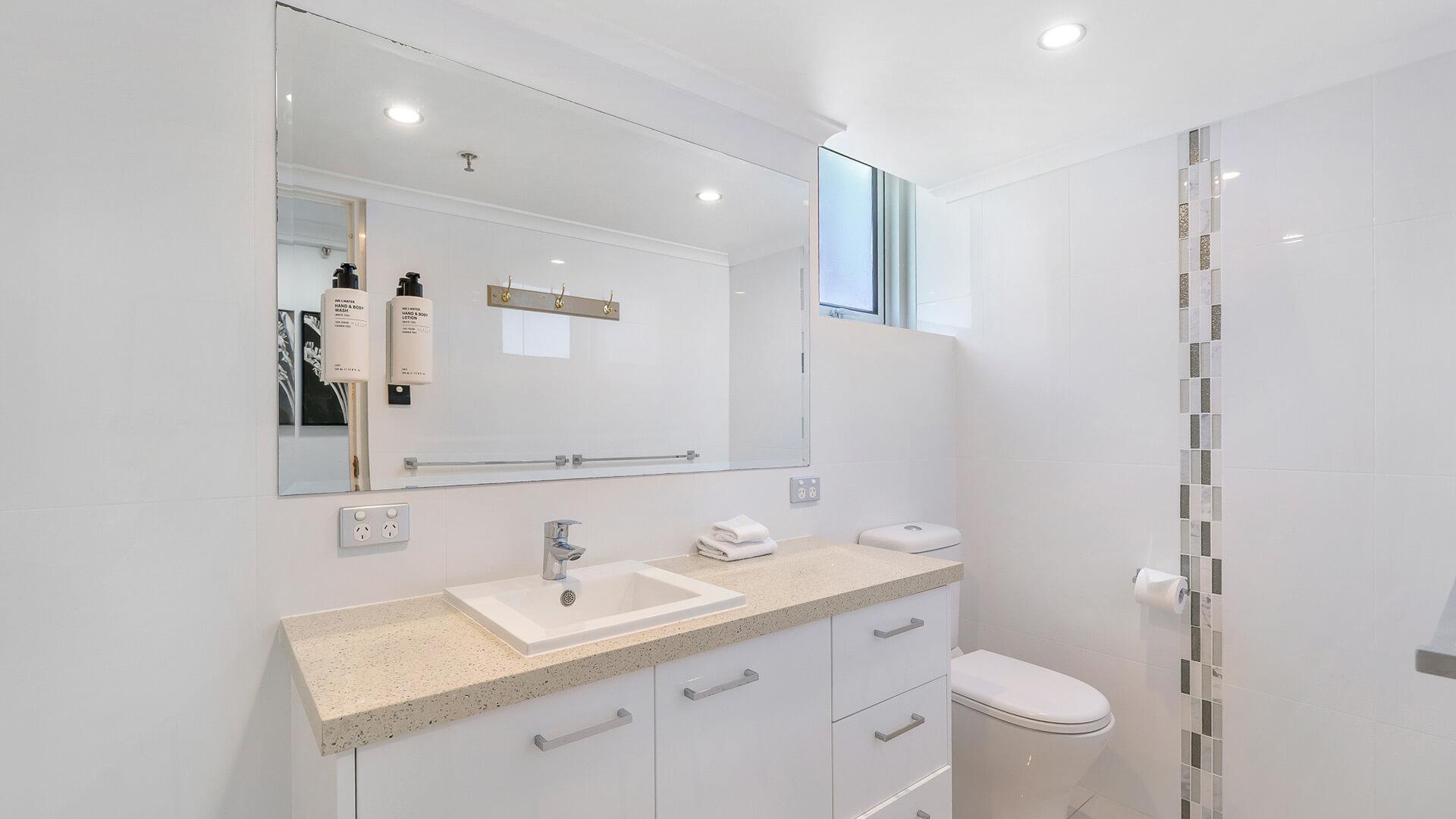 Bright bathroom with walk-in shower in the Sub Penthouse at ULTIQA Beach Haven on Broadbeach.